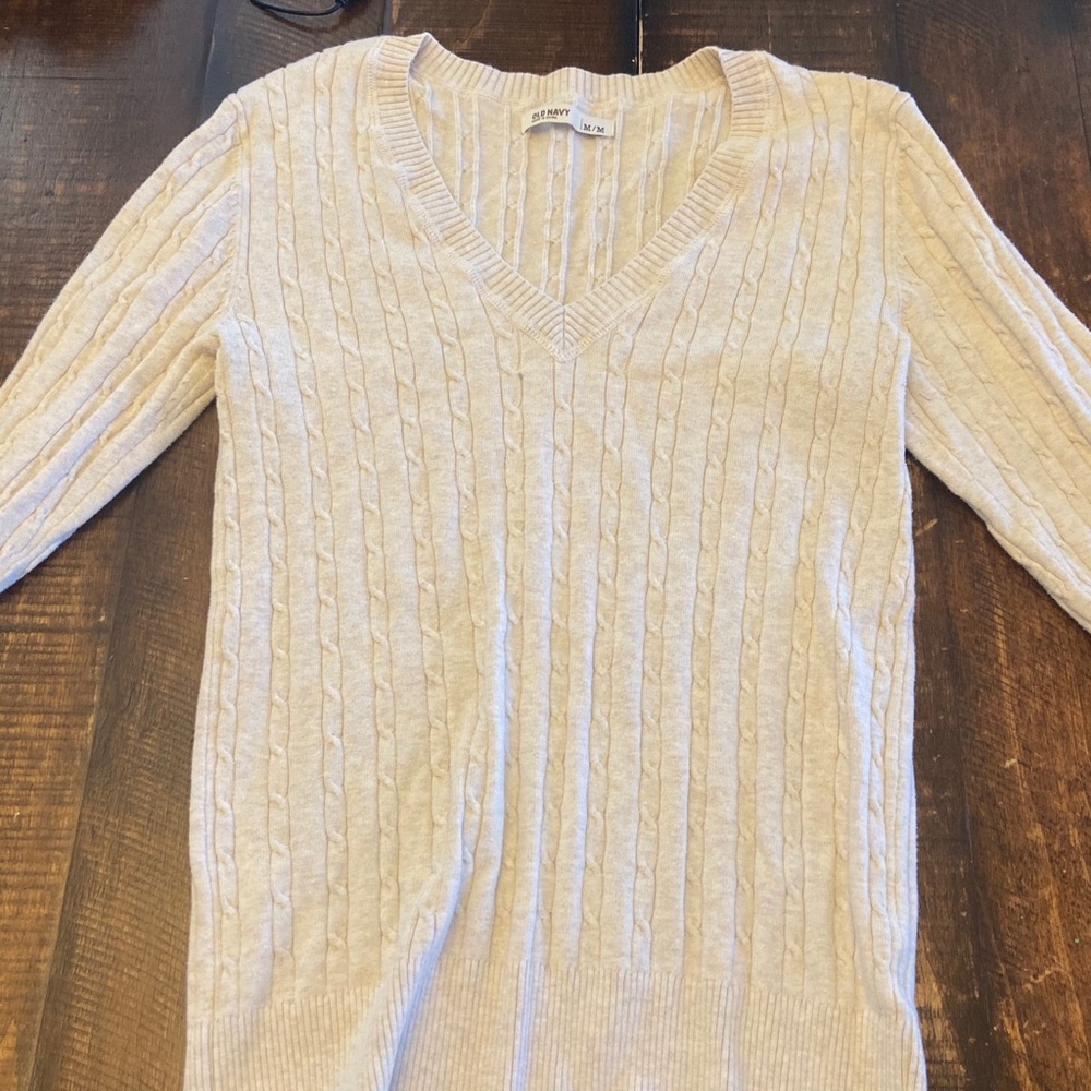 Woman’s beige sweater